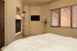 Bedroom 4 has a queen size bed with a gas fireplace and flat screen TV